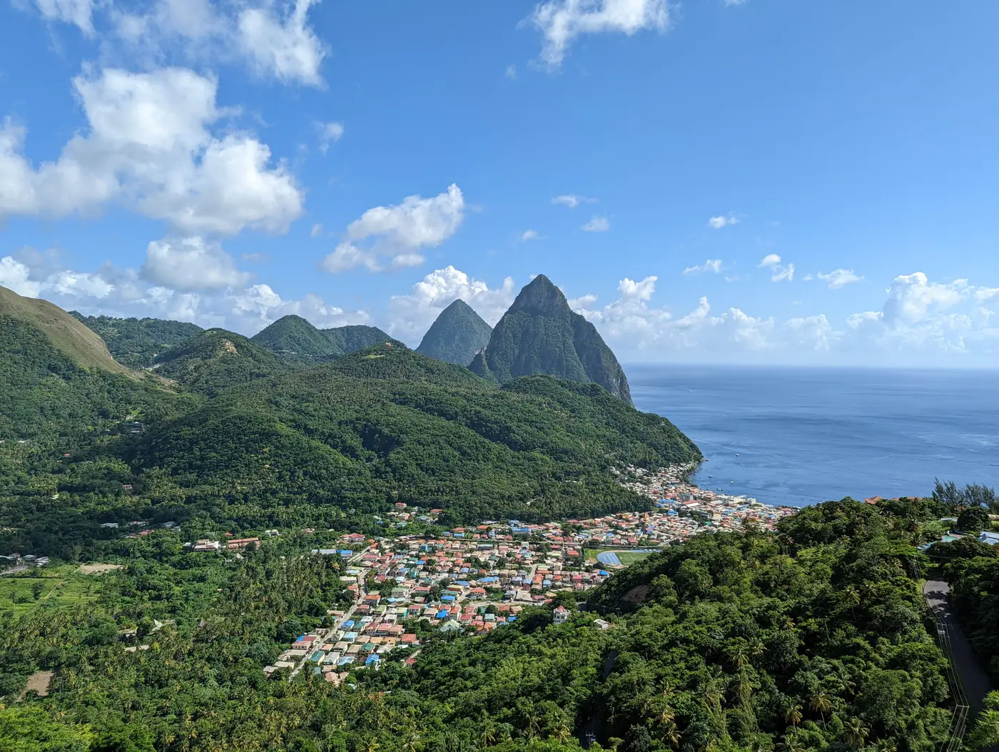 The twin Pitons rising above Soufriere and the Caribbean Sea in St Lucia