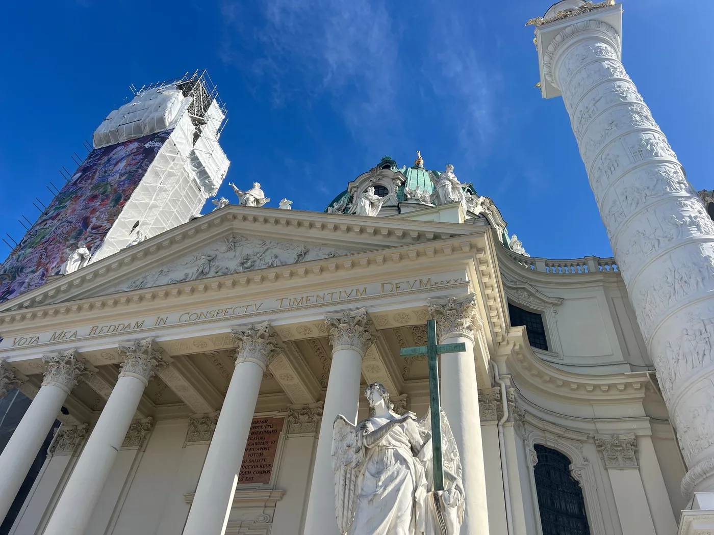 The green dome and carved columns of Karlskirche in Vienna