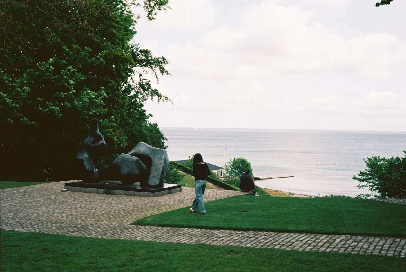 A sculpture on the lawn above the sea at the Louisiana Museum in Humlebæk