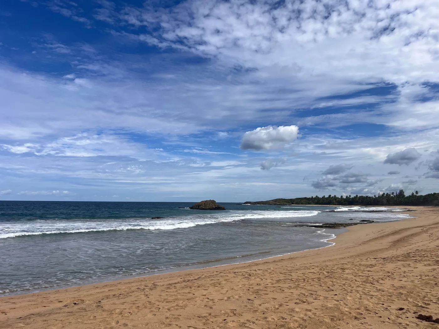 A quiet stretch of sand at Luquillo Beach in Puerto Rico