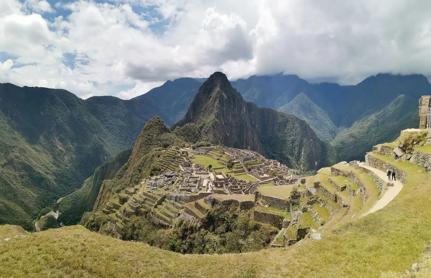 The ruins of Machu Picchu with Huayna Picchu behind them