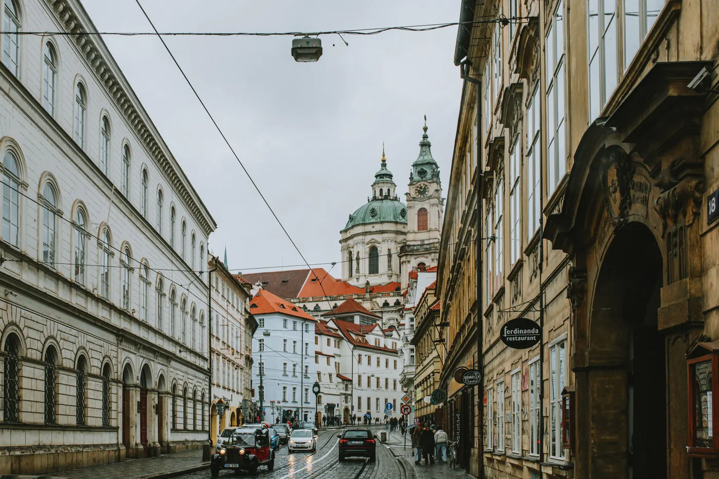 A street in Prague's Lesser Town leading toward the dome of St. Nicholas Church