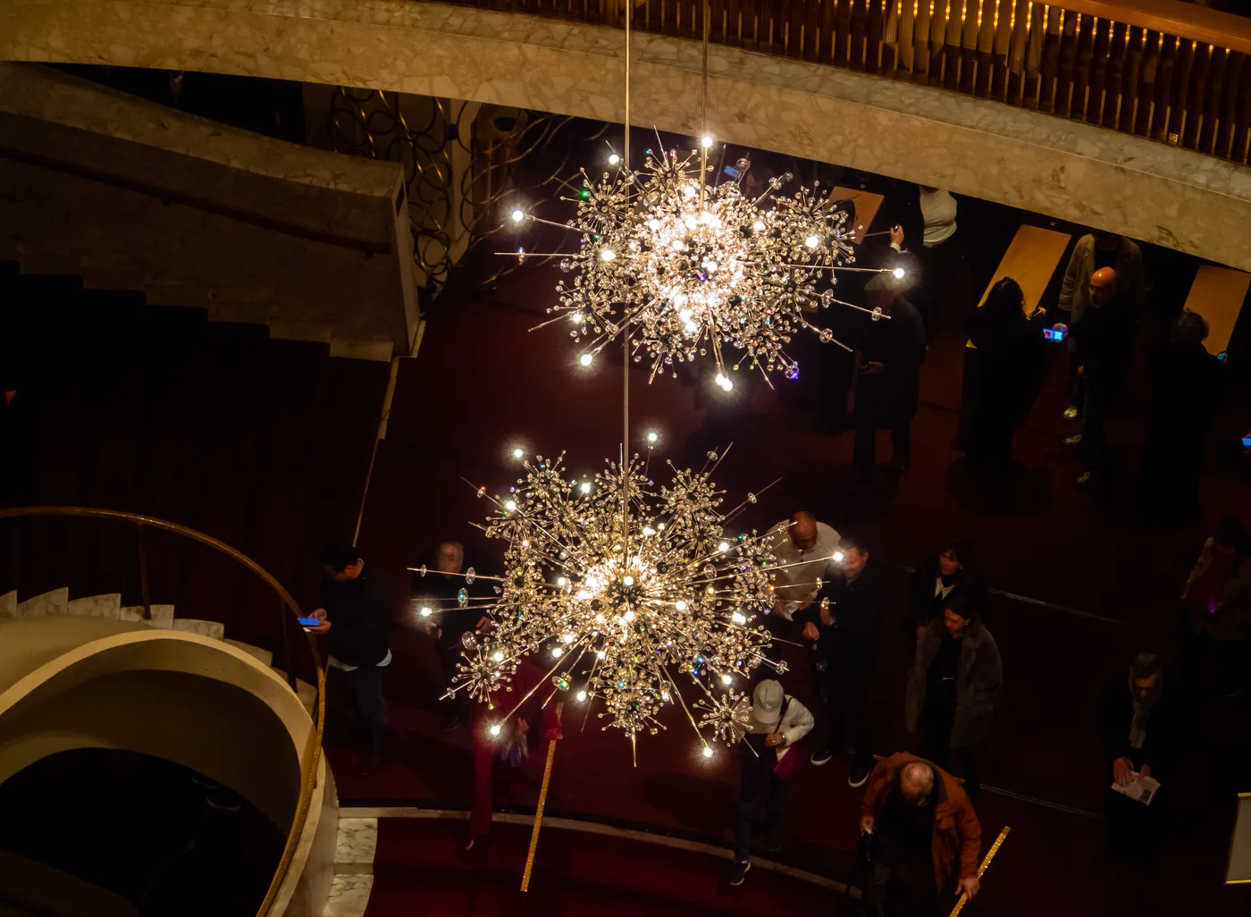 The starburst chandeliers above the lobby of the Metropolitan Opera House