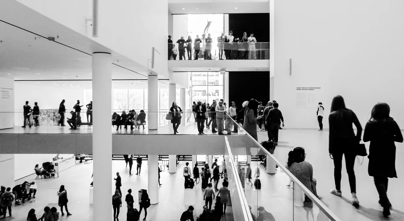 Visitors on the upper floors of a modern art museum