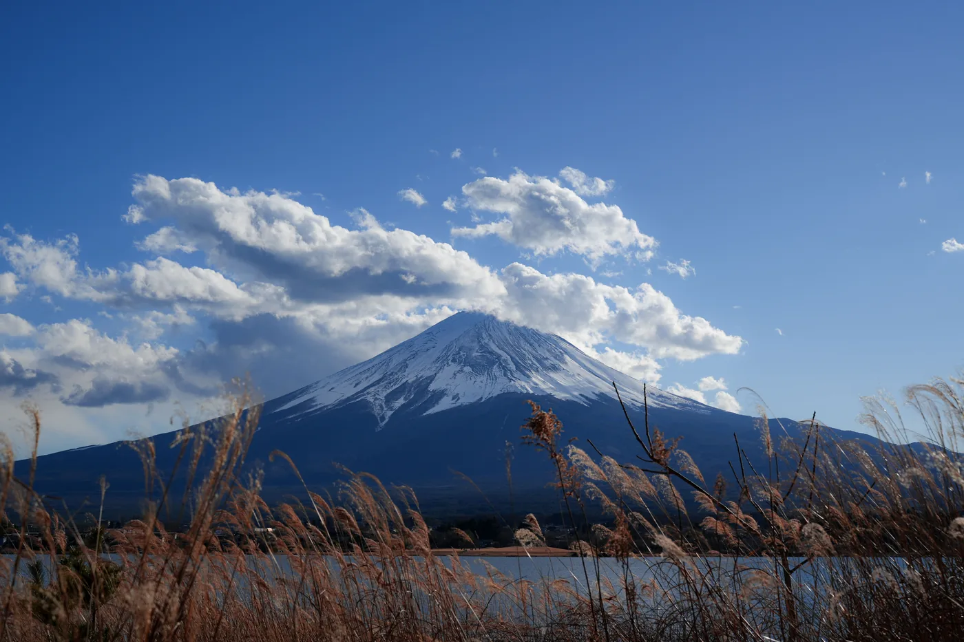 Snowcapped Mount Fuji under a blue sky