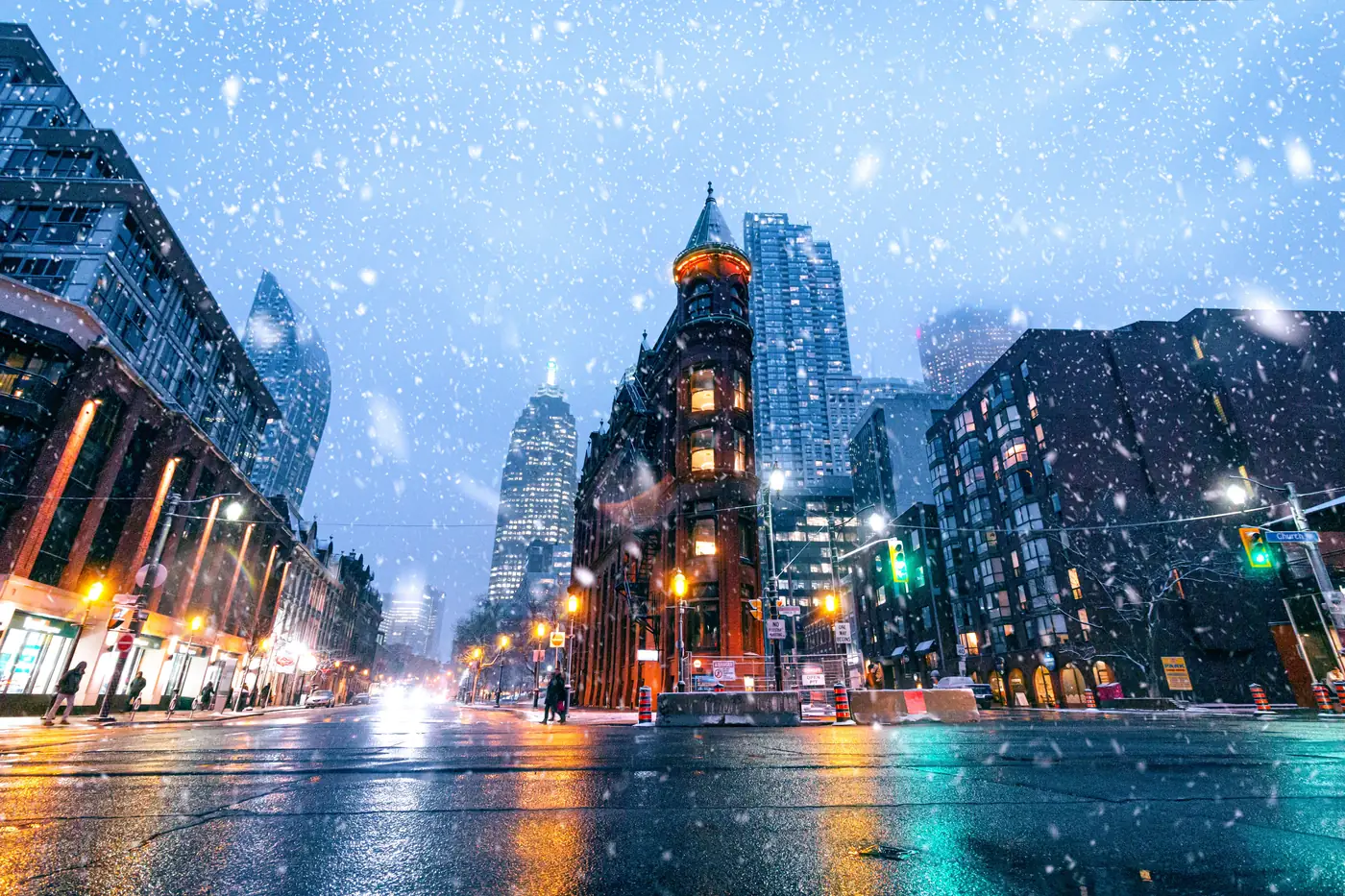 Snow falling at night on a New York City street
