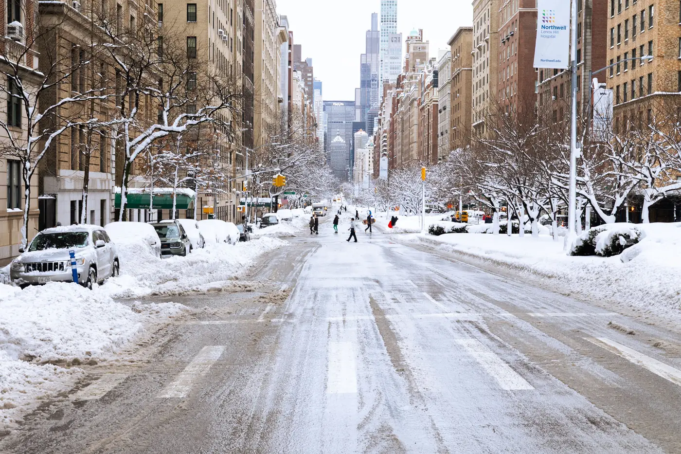 A snow covered avenue in New York City after a winter storm