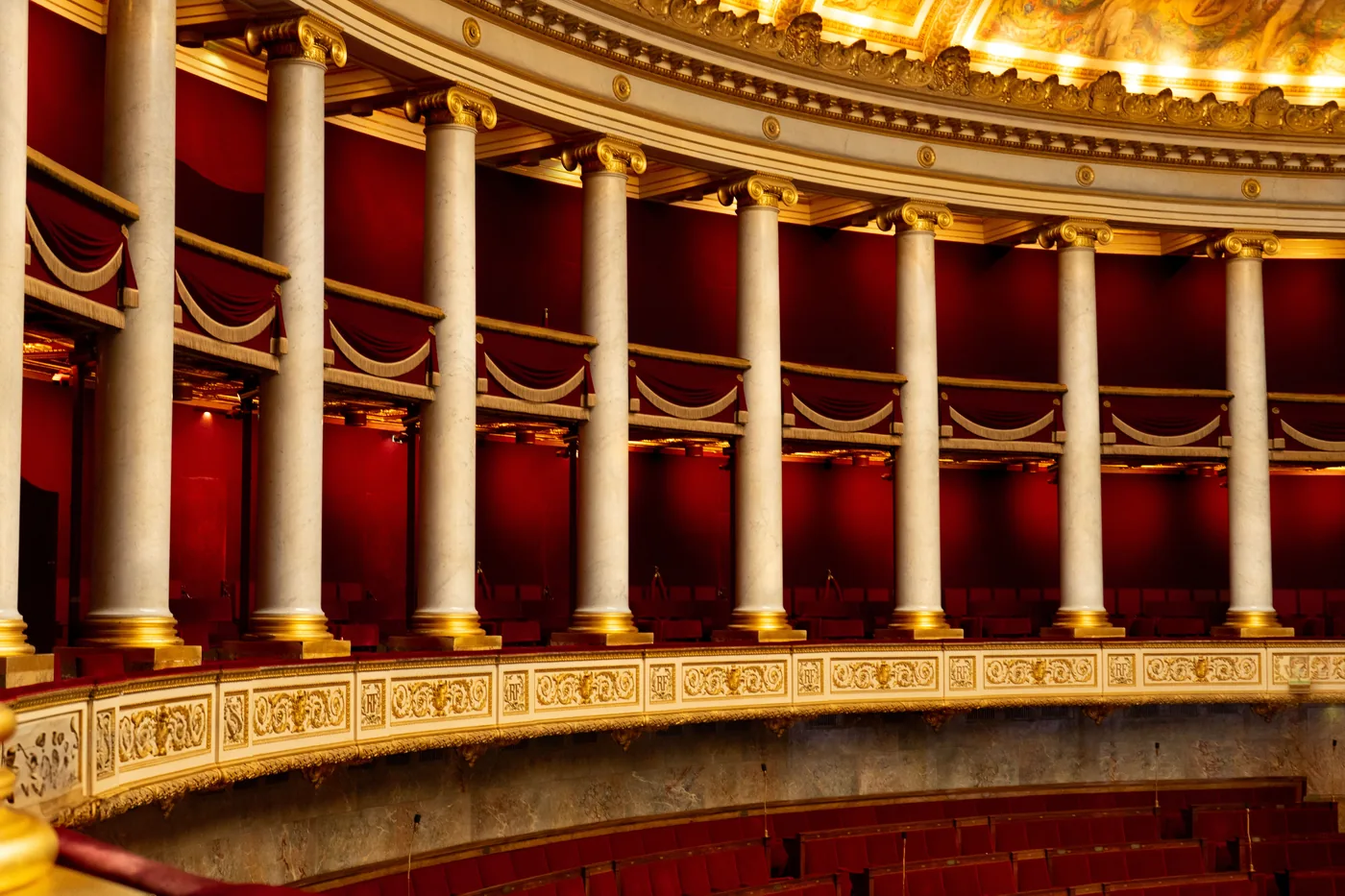 The gilded balconies of an opera house interior
