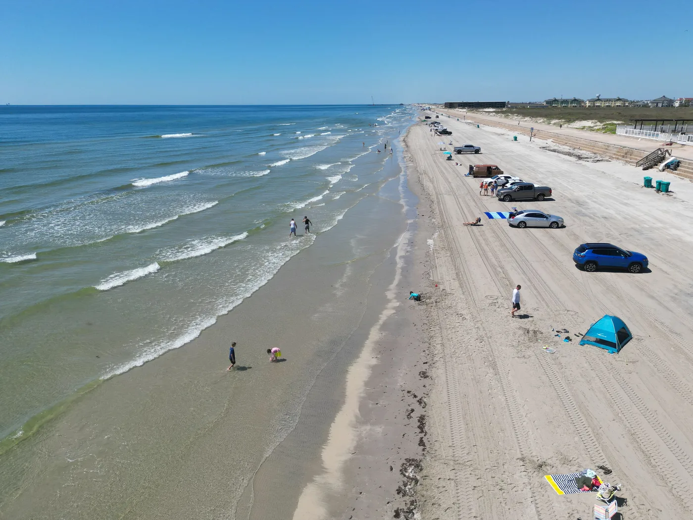 Cars parked along the beach on North Padre Island Texas