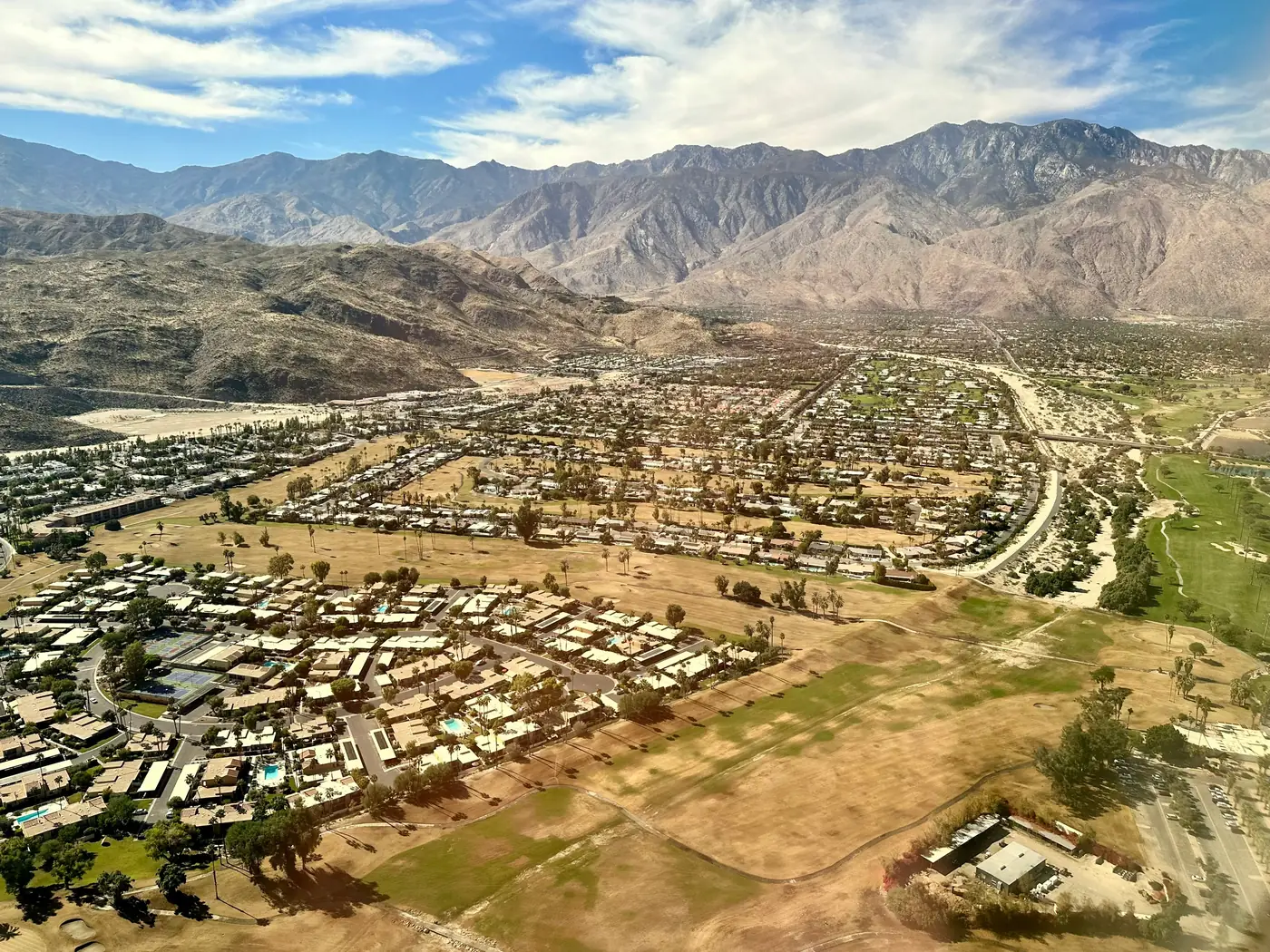 Palm Springs and the Coachella Valley seen from above with the mountains behind