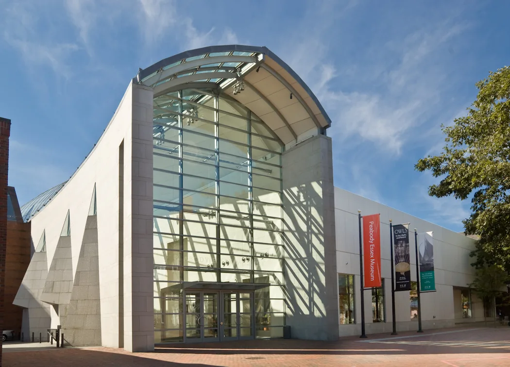The glass entrance of the Peabody Essex Museum in Salem