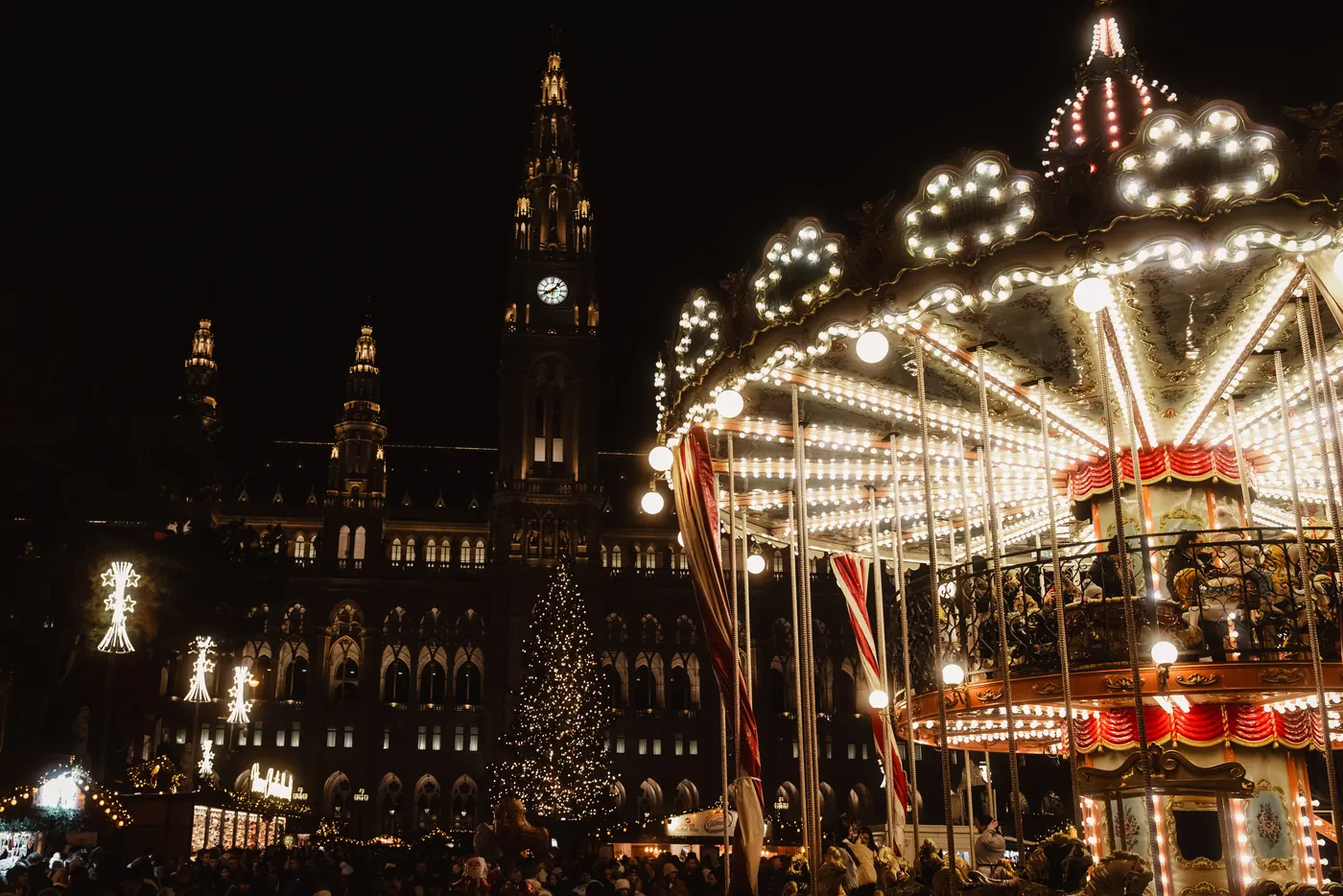Market stalls lit up on a winter evening at a Vienna Christmas market