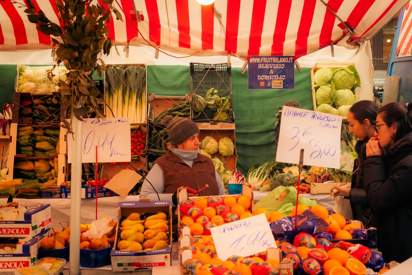 An Italian market stall stacked with winter vegetables