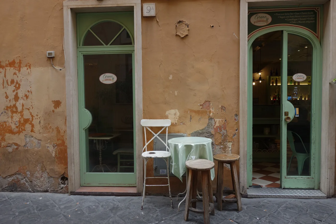 A small Italian cafe with tables set outside