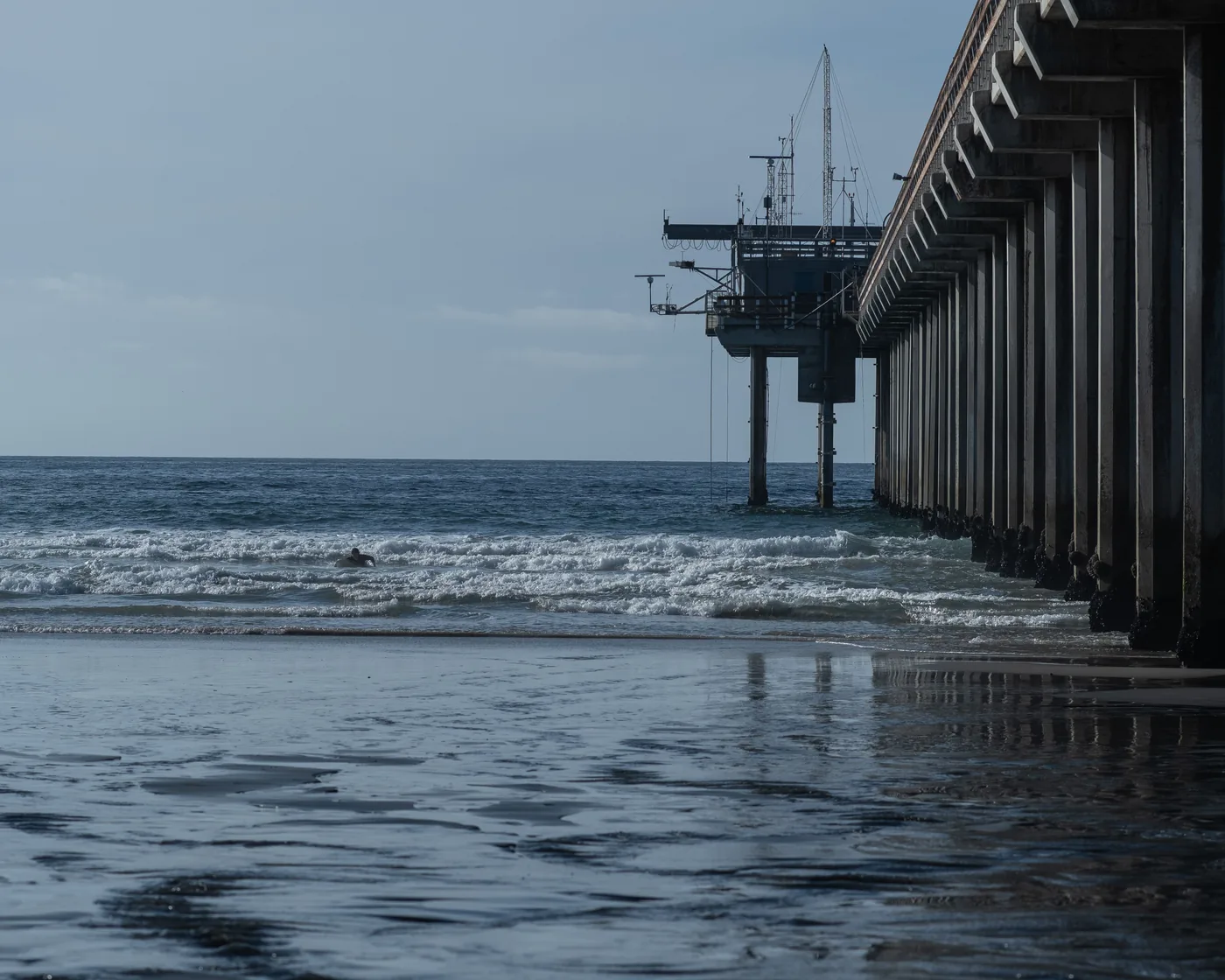 The Scripps Memorial Pier reaching out over the water at La Jolla in San Diego