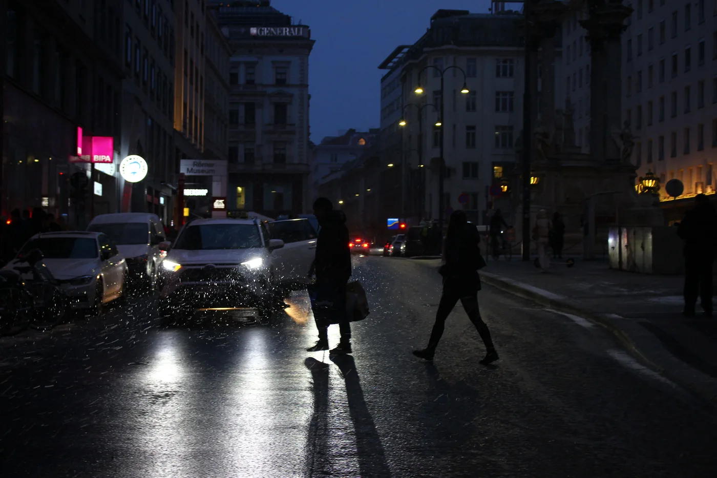 A lit street in central Vienna on a winter night