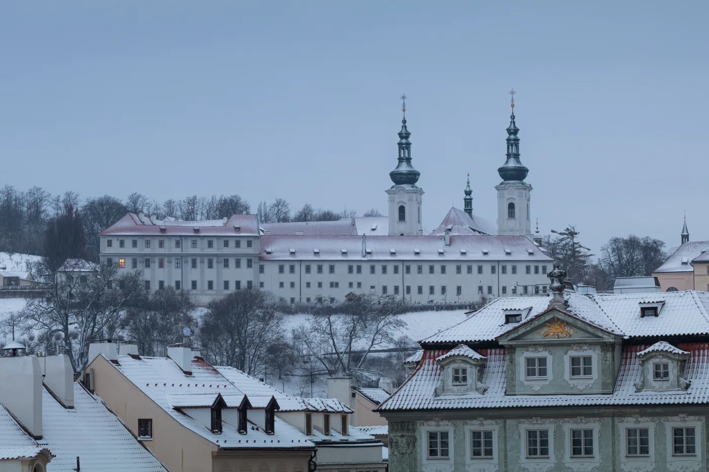 Strahov Monastery and its twin towers above Prague in winter