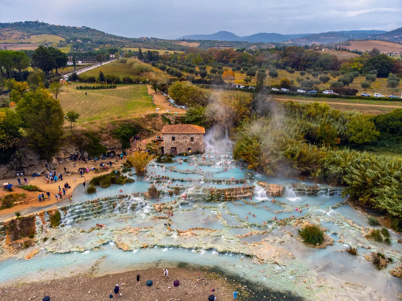 Steaming thermal pools terraced down a hillside in Italy