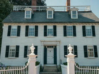 The white Ropes Mansion and its gateposts on Essex Street in Salem Massachusetts
