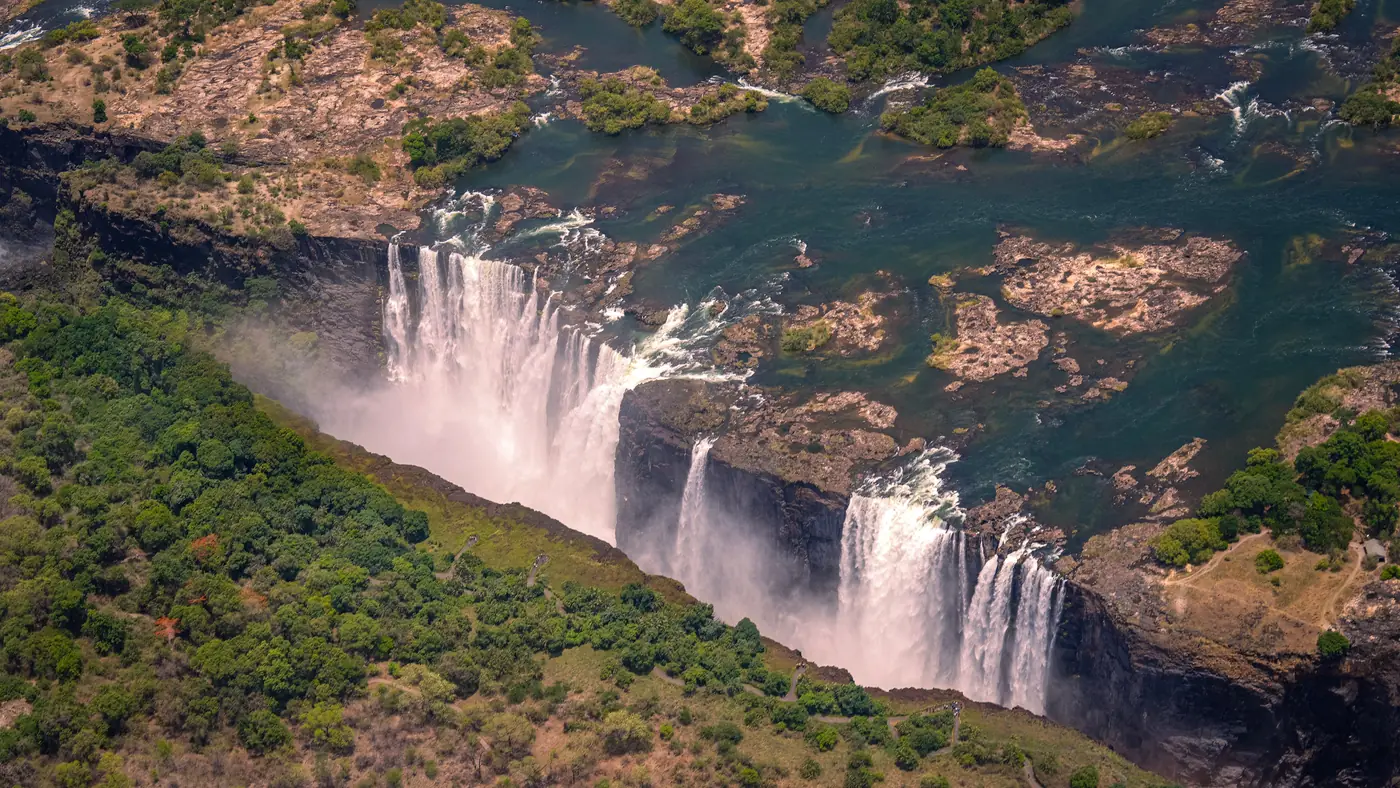An aerial view of Victoria Falls pouring into the gorge