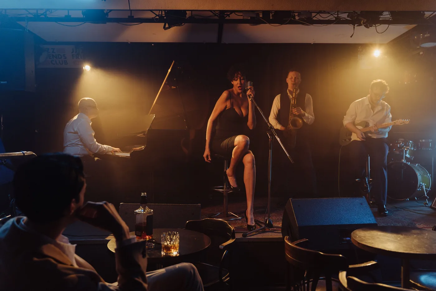 A jazz band playing to a small club crowd