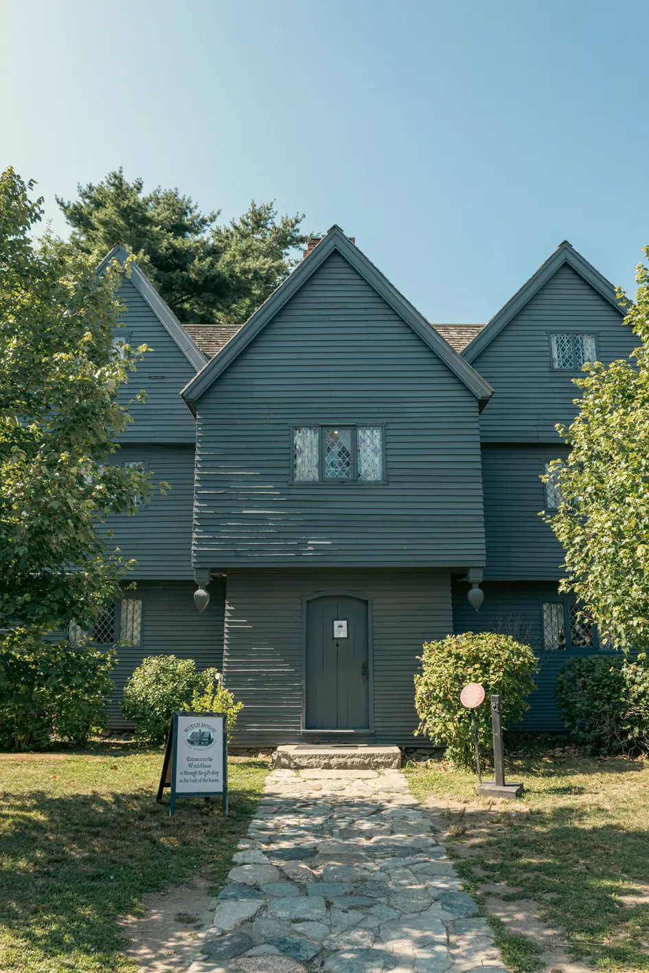 The dark wooden Witch House in Salem Massachusetts on a sunny day