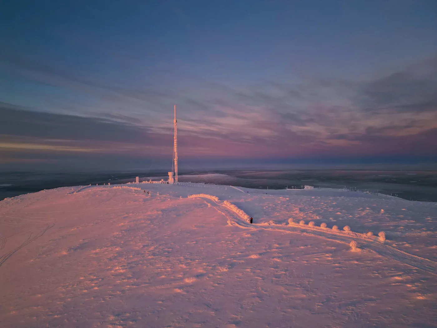 Sunset light on the snowy top of a fell near Ylläs in Finnish Lapland