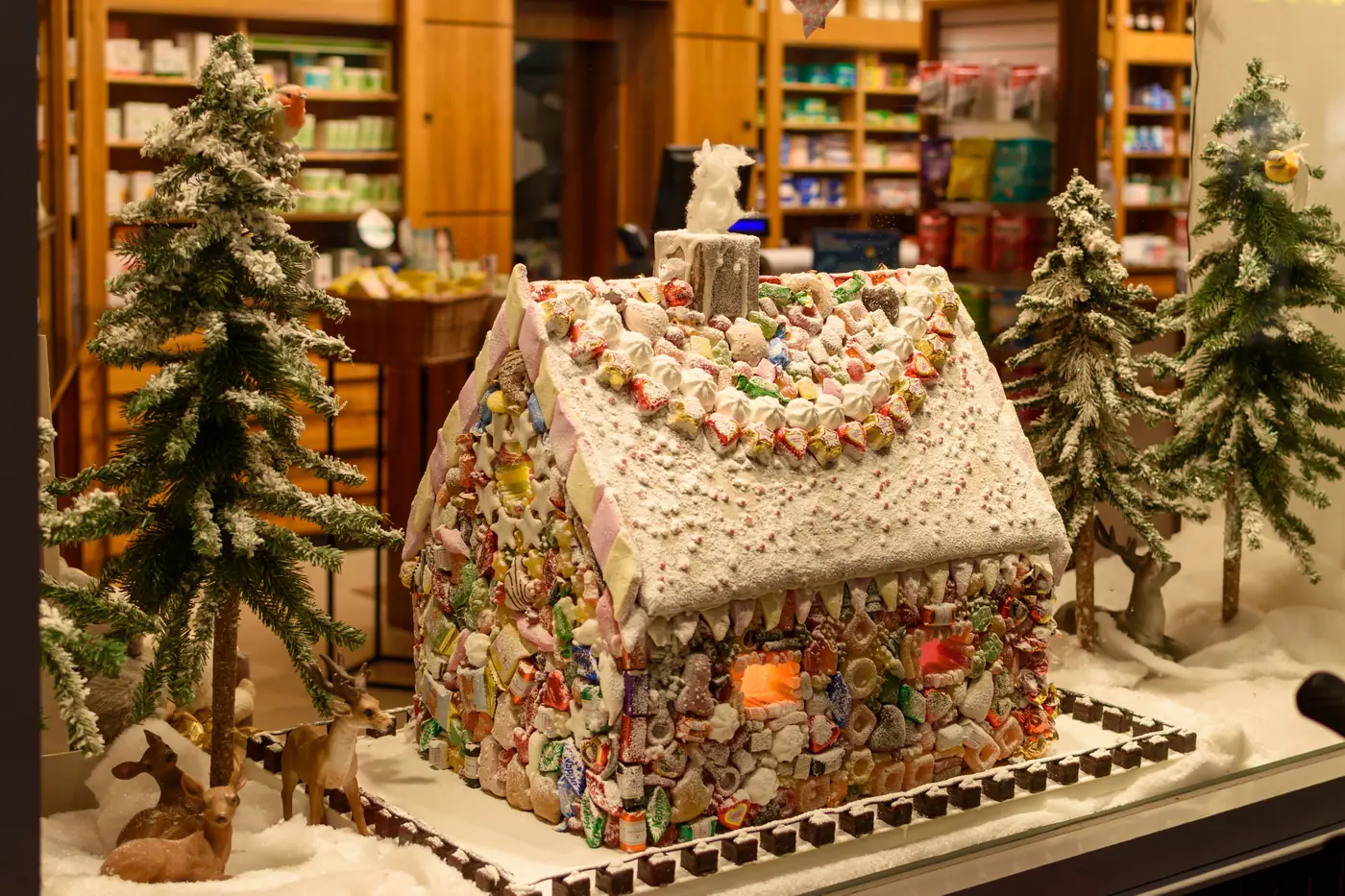 A gingerbread house decorated with icing and candy