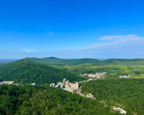 Downtown Hot Springs tucked among the forested Ouachita Mountains, seen from Hot Springs Mountain