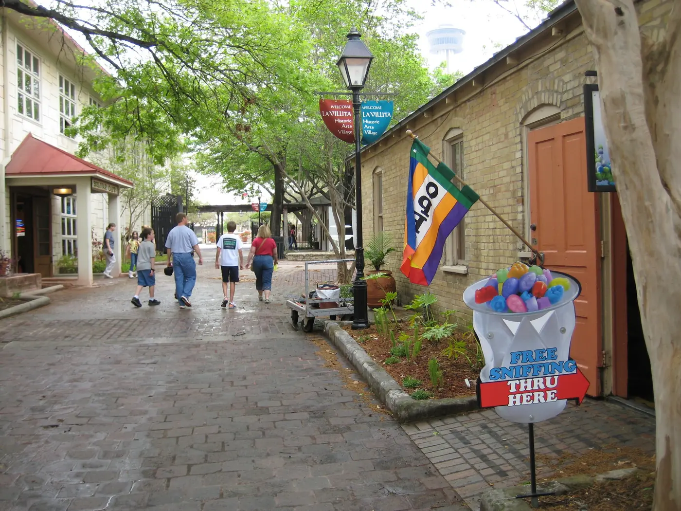A shaded lane lined with small shops in La Villita, San Antonio