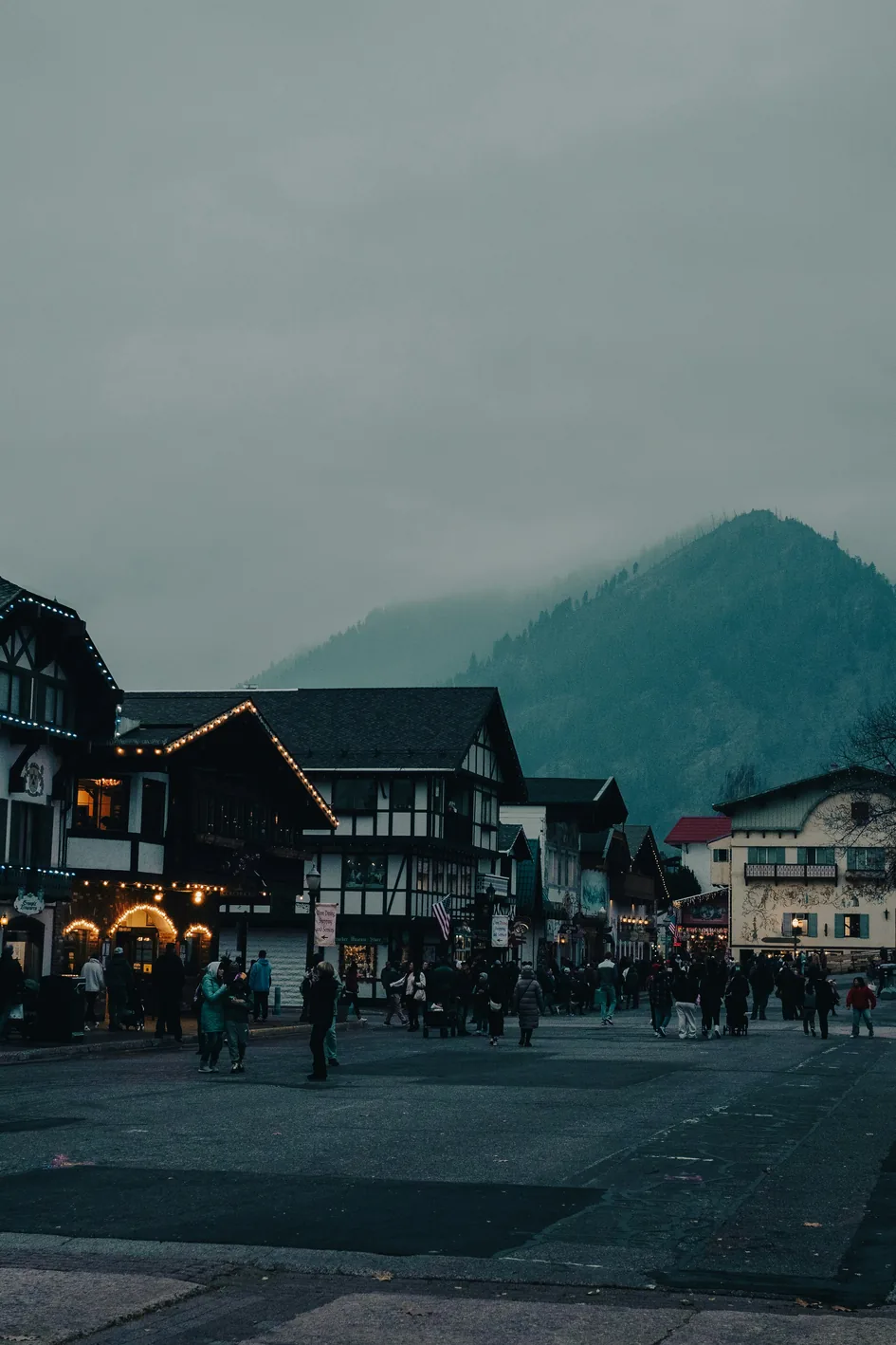 Visitors walking around the town square in Leavenworth at dusk