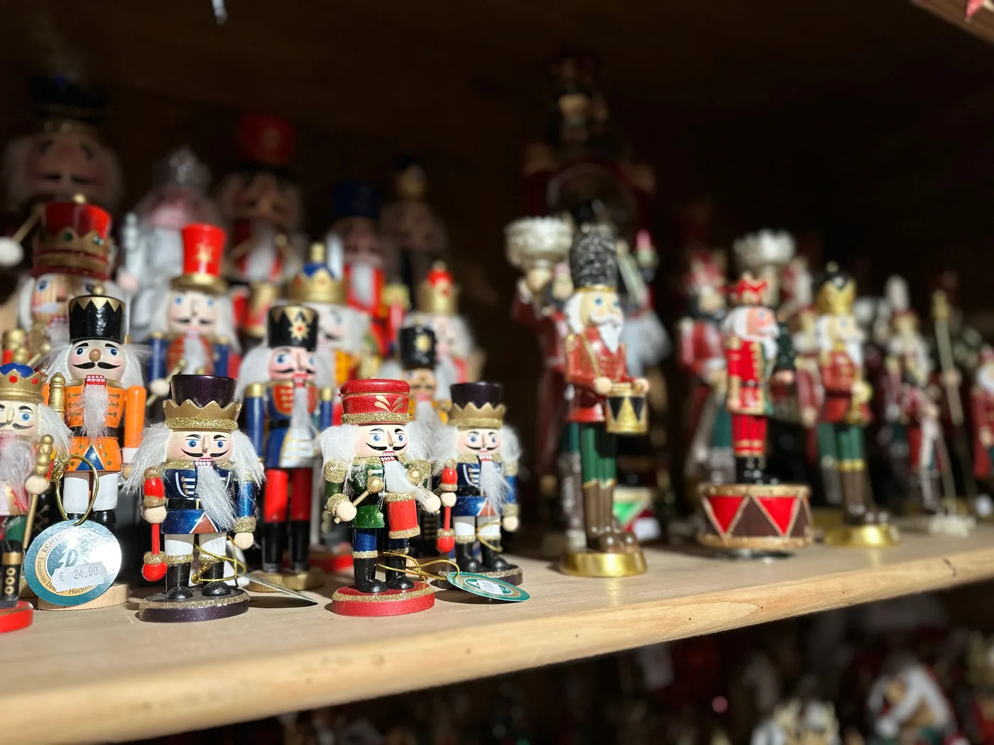 Rows of painted wooden nutcrackers on a shelf