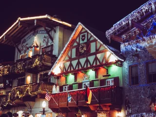 A Bavarian style building covered in Christmas lights at night in Leavenworth, Washington