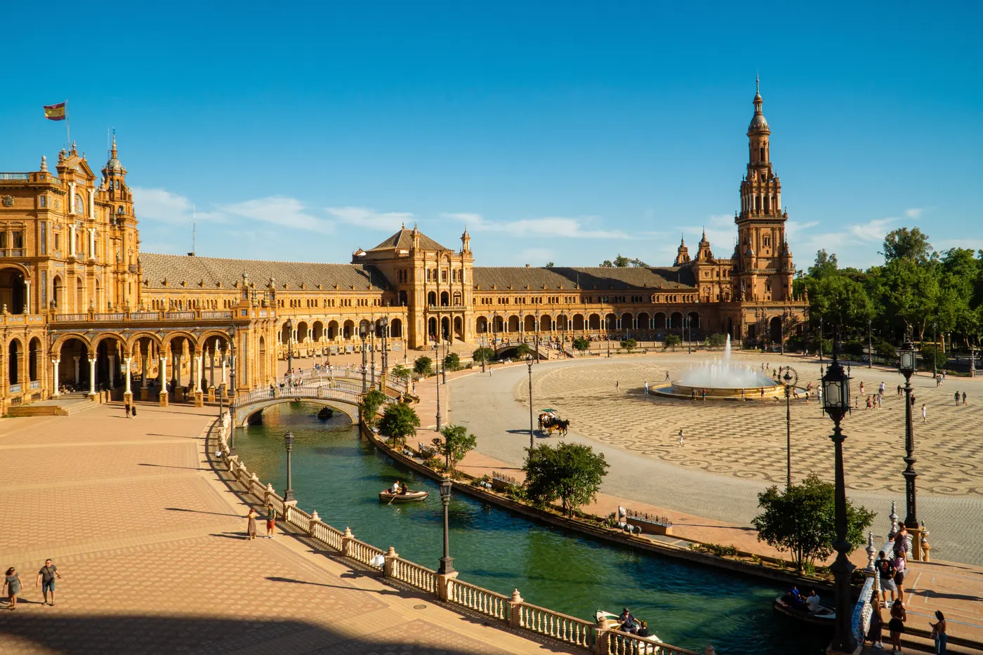 Plaza de España in Seville on a sunny day, with its canal and towers