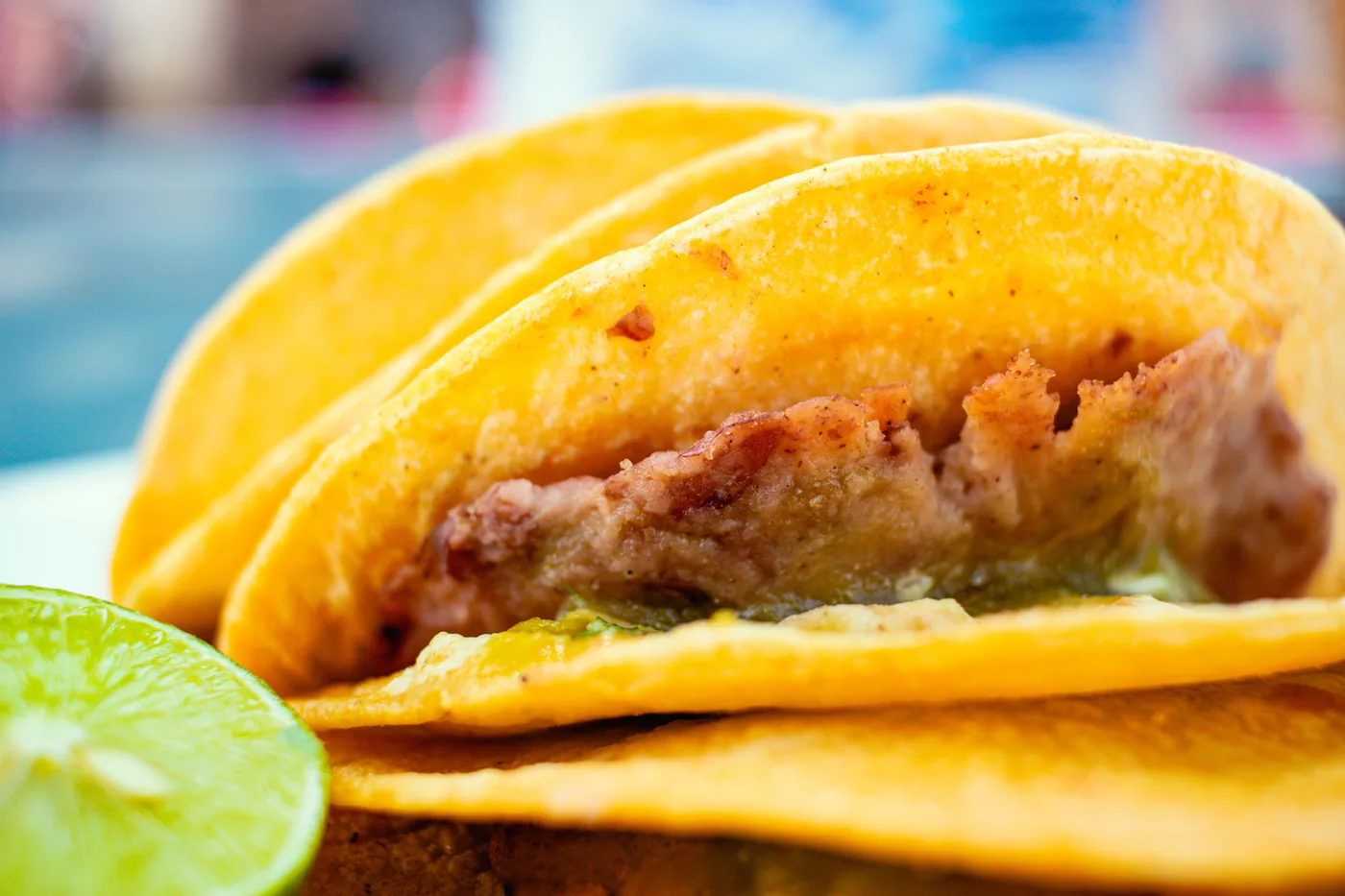 Crispy tacos with a wedge of lime