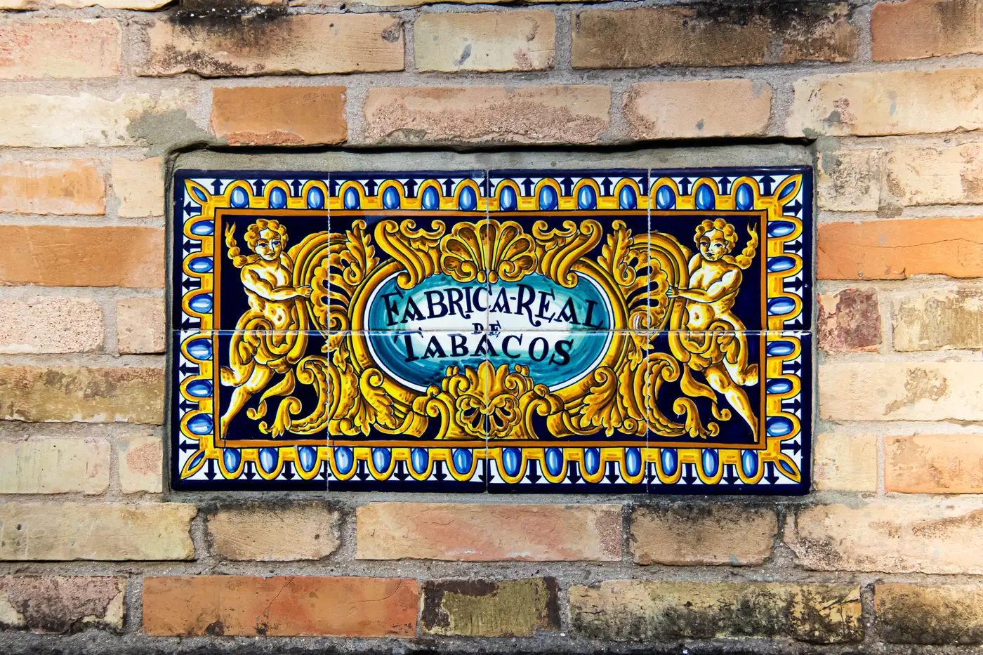 A painted tile sign on the old Royal Tobacco Factory in Seville