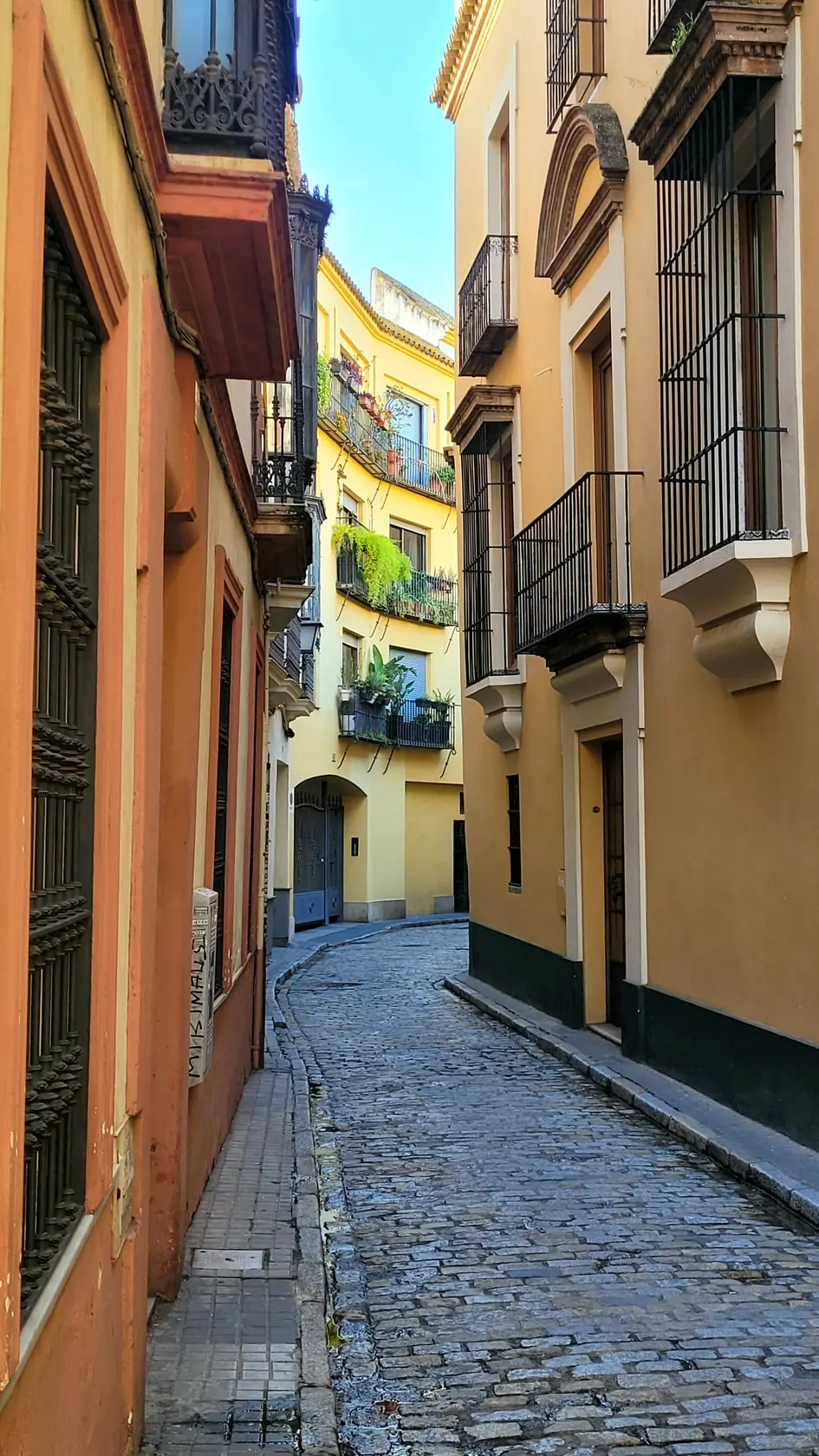 A narrow cobbled lane in Seville's old town