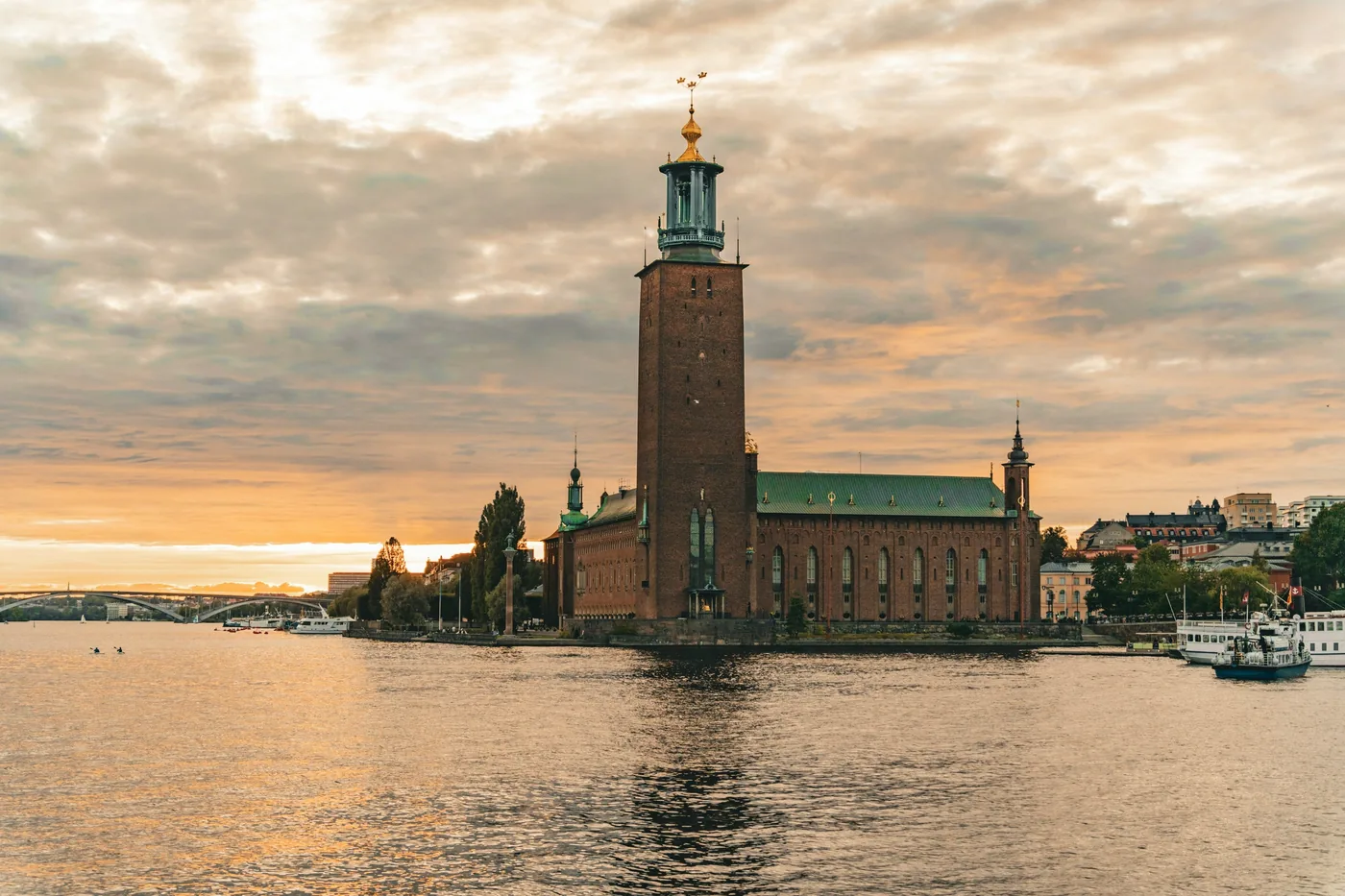 Stockholm City Hall at sunset across the water