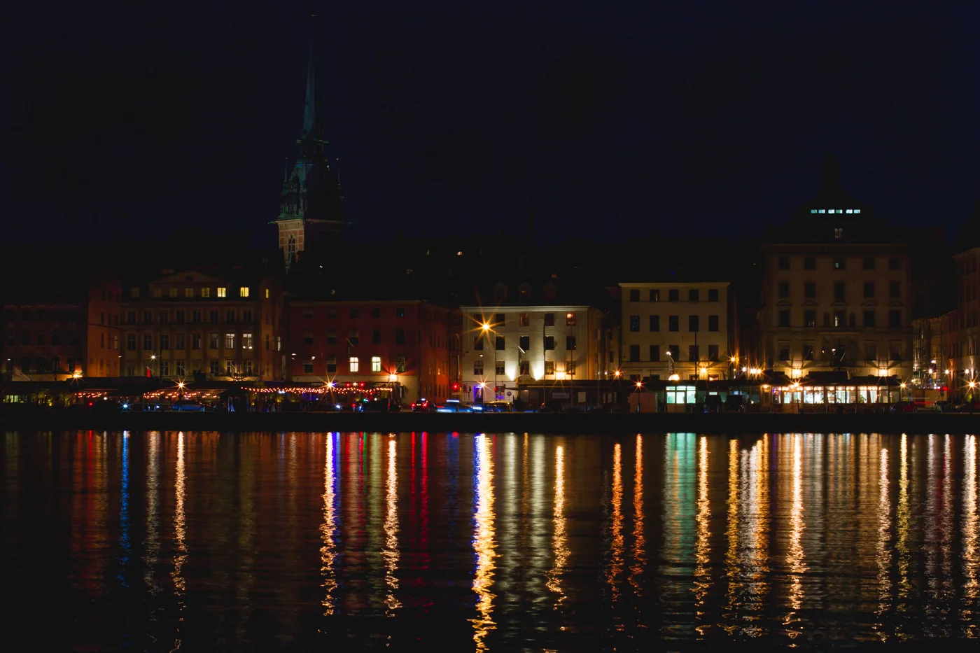 Gamla Stan's waterfront lit up at night in Stockholm