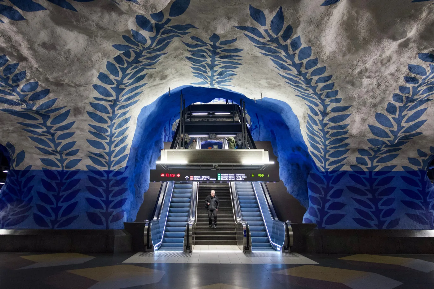 Blue vine paintings on the cave walls of T Centralen station