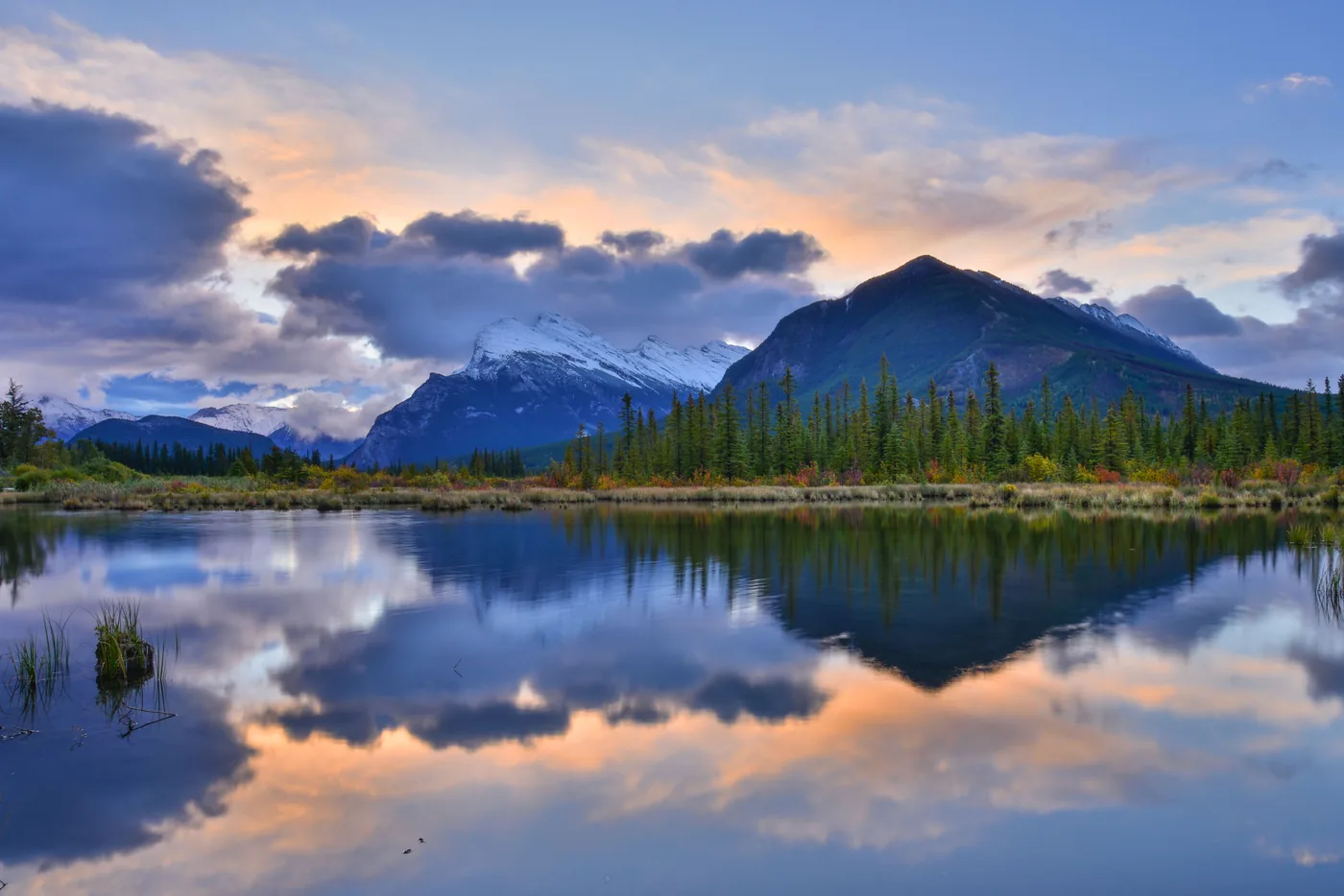 Sunrise clouds reflected in the Vermilion Lakes near Banff